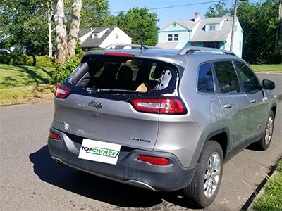 Gray family size SUV Jeep back glass before replacement