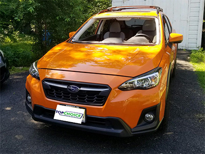 4 door yellow Subaru before windshield replacement