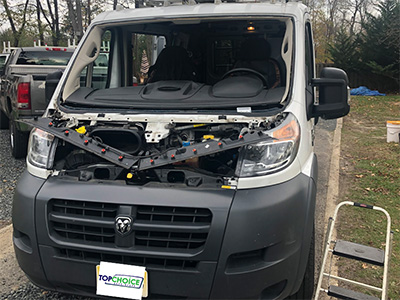 Gray Dodge Van before Top Choice Auto Glass replacement